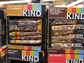 FILE - This Feb. 9, 2017, file photo shows Kind snack bars on display at a supermarket in New York. The government's definition of healthy came under scrutiny in late 2015, when the FDA warned Kind that its snack bars had too much fat to use the term. Kind pushed back, saying the fat came from nuts.