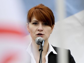 FILE - In this Sunday, April 21, 2013,  file photo, Maria Butina, leader of a pro-gun organization in Russia, speaks to a crowd during a rally in support of legalizing the possession of handguns in Moscow, Russia. A year before federal prosecutors accused Butina of being a secret agent for the Russian government, she was a graduate student at American University working on a sensitive project involving cybersecurity. Her university assignment called for her to gather information on the cyber defenses of U.S. non-profits that champion media freedom, human rights and similar causes. (AP Photo/File)