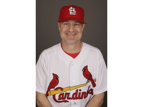 FILE - This 2017 file photo shows David Bell of the St. Louis Cardinals. Bell has been hired as manager of the Cincinnati Reds, tasked with helping turn around a team that skidded to a 67-95 record and last-place finish in the NL Central. The Reds said Sunday, Oct. 21, 2018, he has been given a three-year contract that includes a team option for 2022.