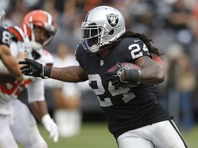 FILE - In this Sept. 30 2018, file photo, Oakland Raiders running back Marshawn Lynch (24) carries against the Cleveland Browns during an NFL football game in Oakland, Calif. A person familiar with the injury says Lynch will miss at least a month with an injured groin. An MRI this week determined the severity of the injury that was first reported by NFL Network.