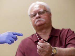 Larry Rebenack, 71, finishes his gene testing procedure Tuesday, Aug. 14, 2018 at Banner Alzheimers Institute in Phoenix. "I have a lot of friends and acquaintances I've seen deteriorate," including one who started blowing through stop signs on a route to a golf course they had safely traveled for years, and another who forgot not only where he had parked his car but even what kind of car it was, Rebenack said. "It's a disease that takes a little part of you away each day."