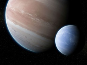 This illustration provided by Dan Durda shows the exoplanet Kepler-1625b with a hypothesized moon. On Thursday, Oct. 4, 2018, two Columbia University researchers reported their results that the potential exomoon would be the size of Neptune or Uranus. The exoplanet, about 8,000 light-years away, is as big as Jupiter.