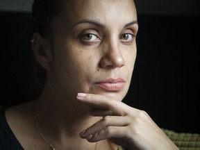 Saturnina Plasencia, 43, sits for a portrait during an interview at her home in New York on Monday Oct. 1, 2018. According to a complaint filed with the U.S. Equal Employment Opportunity Commission, the single mother of three endured sustained sexual harassment by her general manager, who insisted she date him and decreased her working hours in retaliation because she spurned him.