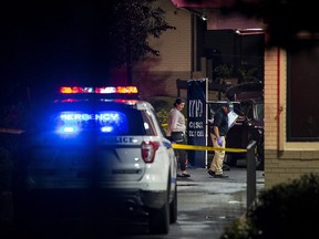 Police investigate a fatal shooting at a McDonald’s  drive-through in the Bronx, Oct. 4, 2018.