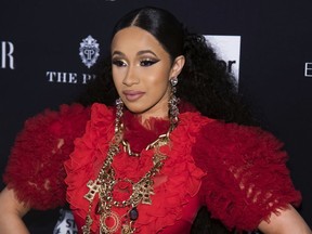 FILE - In this Sept. 7, 2018, file photo, Cardi B attends the Harper's BAZAAR "ICONS by Carine Roitfeld" party at The Plaza in New York. Cardi B is at a New York City police station on Monday, Oct. 1, 2018, as part of an investigation of her possible involvement in a fight at a strip club.