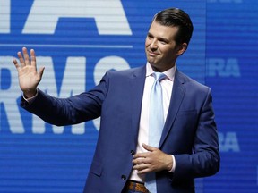 FILE - In this May 4, 2018, file photo, Donald Trump Jr., waves from the stage at the National Rifle Association in Dallas. Donald Trump Jr. will speak Monday, Oct. 1, 2018, at a fundraising event at the Holiday Inn By The Bay in Portland, Maine.