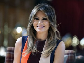 FILE - In this July 13, 2018, file photo, first lady Melania Trump takes a seat during a visit to The Royal Hospital Chelsea in central London. Trump is visiting Philadelphia on Wednesday, Oct. 17, to meet with families of children who were affected by exposure to opioids while in the womb.