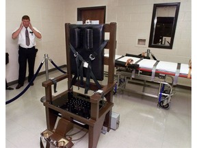In this Oct. 13, 1999, file photo, Ricky Bell, the warden at Riverbend Maximum Security Institution in Nashville, Tenn., gives a tour of the prison's execution chamber.