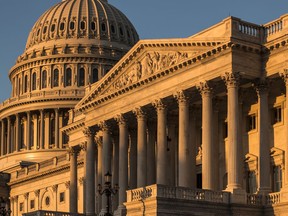 FILE - This Oct. 1, 2018, file photo, shows the Capitol at sunrise in Washington. Republicans have begun to concede defeat in the evolving fight to preserve the House majority. The party's candidates may not go quietly, but from Arizona to Colorado to Iowa, the GOP's most powerful players are shifting resources away from vulnerable Republican House candidates deemed too far gone and toward those thought to have a better chance of political survival.