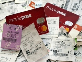 FILE- This Aug. 23, 2018, file photo shows Movie Pass debit cards and used movie tickets in New York. The company that runs the beleaguered MoviePass, a discount service for movie tickets at theaters, is being investigated by the New York Attorney General on allegations it misled investors.