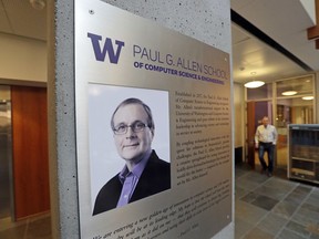 FILE- In this Monday, Oct. 15, 2018, file photo a portrait of Paul Allen stands on a wall at the Paul G. Allen School of Computer Science & Engineering at the University of Washington in Seattle. Prior to his death on Monday, Allen invested large sums in technology ventures, research projects and philanthropies, some of them eclectic and highly speculative. Outside of bland assurances from his investment company, no one seems quite sure what happens now.