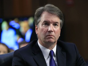 FILE - In this Sept. 4, 2018 photo, Supreme Court nominee Brett Kavanaugh, listens to Sen. Cory Booker, D-N.J. speak during a Senate Judiciary Committee nominations hearing on Capitol Hill in Washington. FBI agents interviewed one of the three women who have accused Kavanaugh of sexual misconduct as Republicans and Democrats quarreled over whether the bureau would have enough time and freedom to conduct a thorough investigation before a high-stakes vote on his nomination to the nation's highest court.
