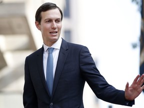 FILE - In this Aug. 29, 2018 photo, White House Adviser Jared Kushner waves as he arrives at the Office of the United States Trade Representative for talks on trade with Canada, in Washington. CBS News said Wednesday, Oct. 17 a Secret Service agent blocked one of its correspondents from asking Kushner a question when he was walking out of an airplane, saying there was a "time and a place" for such interactions. CBS said reporter Errol Barnett showed a press credential and attempted to ask a question about Saudi writer Jamal Khashoggi.