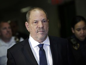 FILE - In this Oct. 11, 2018 file photo, Harvey Weinstein enters State Supreme Court in New York. New York prosecutors say the former lead police detective in Weinstein's sexual assault investigation urged one of his accusers to delete information from her phone before turning it over to prosecutors. The Manhattan District Attorney's office detailed the alleged misconduct in a letter to Weinstein's lawyer that was made public Wednesday, Oct. 17.