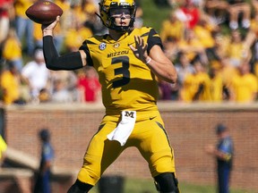 FILE - In this Saturday, Sept. 22, 2018, file photo, Missouri quarterback Drew Lock throws a pass during the first half of an NCAA college football game against Georgia in Columbia, Mo. The bye week came at a good time for Lock and Missouri, which hung with Georgia before mistakes wound up biting them. Missouri committed three turnovers and had a punt blocked that resulted in a touchdown.