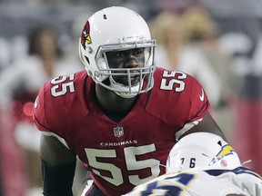 FILE - In this Aug. 11, 2018, file photo, Arizona Cardinals defensive end Chandler Jones (55) looks over the line of scrimmage during the first half of an preseason NFL football game against the Los Angeles Chargers in Glendale, Ariz. With his MMA-trained hands knocking would-be blockers out of the way, the defensive end has quietly established himself as one of the best in the game.