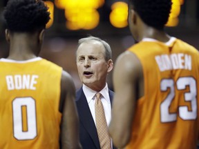 FILE - In this Jan. 9, 2018, file photo, Tennessee coach Rick Barnes talks with Jordan Bone (0) and Jordan Bowden (23) during a timeout in the second half of an NCAA college basketball game against Vanderbilt in Nashville, Tenn. Barnes says Vols won't get complacent as they return the nucleus of the team that won a share of SEC regular-season title last year.