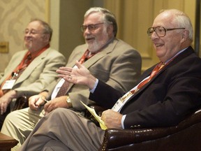 FILE - In this June 24, 2004, file photo, Dave Anderson, New York Times sports columnist, right, gestures while on a panel discussion with, from left, Jerry Izenberg, Newark Star-Ledger sports columnist, and Bill Conlin, Philadelphia Daily News sports columnist, while honoring the late Jimmy Cannon, New York Journal-American sports columnist, with the Red Smith Award during the Associated Press Sports Editors convention in Philadelphia. Anderson, a Pulitzer Prize-winning sports columnist, died Thursday, Oct. 4, 2018, at an assisted living facility in Cresskill, N.J., The New York Times said. He was 89.