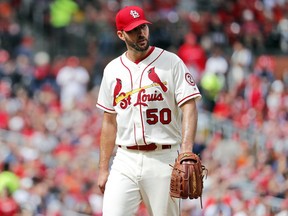 FILE - In this Sept. 22, 2018, file photo, St. Louis Cardinals starting pitcher Adam Wainwright walks off the field after being removed in the seventh inning of a baseball game against the San Francisco Giants in St. Louis. Wainwright's contract with the Cardinals has been put on hold because it violates the maximum-cut rule, and the pitcher will have to become a free agent before the agreement can be finalized, people familiar with the deal told The Associated Press, Thursday, Oct. 18, 2018. St. Louis announced the agreement with the 37-year-old right-hander on Oct. 11. He was earning $19.5 million annually, and the new deal guarantees less than $15.6 million.