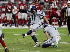 FILE - In this Sunday, Sept. 30, 2018, file photo, Seattle Seahawks kicker Sebastian Janikowski (11) kicks the game-winning field goal as punter Michael Dickson (4) holds during the second half of an NFL football game against the Arizona Cardinals in Glendale, Ariz. The Seahawks kicker, who spent 18 seasons with the Raiders, faces his old team on Sunday.