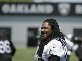 FILE - In this May 23, 2017, file photo, Oakland Raiders running back Marshawn Lynch stretches during NFL football practice in Alameda, Calif. Oakland may always be home for Lynch but Seattle was the city that truly made him a star. The Seahawks (2-3) will get an up-close look at Lynch again this week for the first time since he retired following the 2015 season when they travel to London to face the Raiders (1-4).
