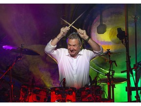 This Sept. 23, 2018 photo released by Jill Furmanovsky shows Pink Floyd drummer Nick Mason performing with Nick Mason's Saucerful of Secrets band in Portsmouth, England.  Mason is planning to tour North America next year to perform some classic Floyd songs. His band will be jamming to pre-"Dark Side of the Moon" material.