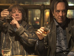This image released by Fox Searchlight Pictures shows Melissa McCarthy, left, and Richard E. Grant in a scene from "Can You Ever Forgive Me?"