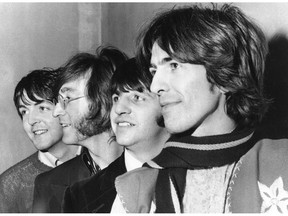 FILE - This Feb. 28, 1968 file photo shows The Beatles, from left, Paul McCartney, John Lennon, Ringo Starr and George Harrison. The Beatles have released a new music video on Apple Music for their 1968 song, "Glass Onion." The video was released Tuesday and features rare photos and performance footage. The song appeared on their self-titled ninth album, often referred to as the "White Album," which celebrates its 50th anniversary this year. (AP Photo, File)