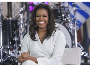 FILE - In this Oct. 11, 2018 file photo, Michelle Obama participates in the International Day of the Girl on NBC's "Today" show in New York. Oprah Winfrey and Reese Witherspoon will be among the special guests when Michelle Obama goes on tour for her memoir "Becoming."