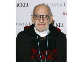 FILE - In this Dec. 10, 2014 file photo, playwright Larry Kramer attends Acria's 19th Annual Holiday Dinner Benefit in New York. Bill Goldstein has been tapped to write the authorized biography of Kramer by Henry Holt and Company. The yet-untitled book will draw on interviews with Kramer; his husband David Webster; friends and foes; as well as papers in Kramer's archives at Yale University.