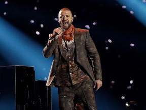 FILE - In this Feb. 4, 2018 file photo, Justin Timberlake performs during halftime of the NFL Super Bowl 52 football game  in Minneapolis. Timberlake says he is postponing his Wednesday night concert in New York City because his vocal chords are "severely bruised." He says he has rescheduled the Madison Square Garden concert for January 31, which is his 38th birthday.