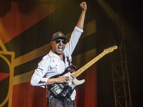 FILE - In this Oct. 1, 2017 file photo, Tom Morello, of Prophets of Rage, performs at the Louder Than Life Music Festival in Louisville, Ky. Morello released his latest album, "The Atlas Underground," on Friday.