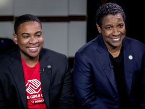 FILE - In this Sept. 26, 2018 file photo, actor Denzel Washington, right, and Malachi Haynes appear at an interview with Fox News Anchor Chris Wallace at the National Press Club in Washington. The Boys & Girls Clubs of America named Haynes the Southwest Youth of the Year. The organization, which began in 1860, offers a positive alternative to children than roaming the street. Washington, who joined when he was 5, is a national spokesman for the organization.