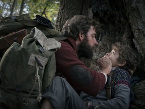 This image released by Paramount Pictures shows John Krasinski, left, and Noah Jupe in a scene from "A Quiet Place." The film is a mostly silent horror film about a family trying to live among creatures that attack and kill at the smallest sound. It became a surprise box office phenomenon when it was released in theaters in April, grossing $338.6 million in worldwide ticket sales off a production budget of only $17 million. A sequel is already in the works.