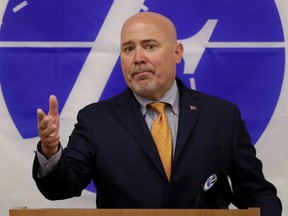 In this July 10, 2018, photo, U.S. Rep. Tom MacArthur speaks about the opioid epidemic during a talk at the Express Scripts mail-in pharmacy in Florence, N.J. In an election that hinges on Trump's standing, candidates from both parties are tiptoeing around the man in the Oval Office as they deliver closing messages in the nation's top House battlegrounds.