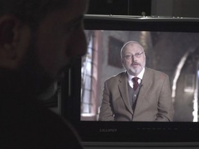 In this image made from an Oct. 18, 2018, video provided by Metafora Production, Eiad Alhaji, left, edits video in his studio as Jamal Khashoggi on a monitor speaks during an interview held in March 2018 at an undisclosed location. Eighteen days after Khashoggi disappeared, Saudi Arabia acknowledged early Saturday, Oct. 20, 2018, that the 59-year-old writer has died in what it said was a "fistfight" inside the Saudi consulate in Istanbul. (Metafora Production via AP)
