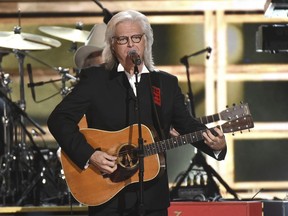 FILE - In this Nov. 2, 2016, file photo, J. Ricky Skaggs performs "Country Boy" at the 50th annual CMA Awards at the Bridgestone Arena in Nashville, Tenn. Skaggs, singer Dottie West and fiddler Johnny Gimble were inducted Sunday, Oct. 21, 2018, at the Hall of Fame and Museum in Nashville, Tennessee, in a ceremony featuring performances from Garth Brooks, Chris Stapleton, Connie Smith and Dierks Bentley.