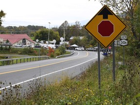 Television networks broadcast at the roadside memorial scene of Saturday's fatal limousine crash in Schoharie, N.Y., Monday, Oct. 8, 2018. A limousine loaded with people headed to a birthday party blew the stop sign at the end of a highway and slammed into an SUV parked outside a store, killing all people in the limo and a few pedestrians, officials and relatives of the victims said.