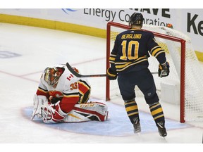 Buffalo Sabres forward Patrik Berglund (10) is stopped by Calgary Flames goalie David Rittich (33) during the first period of an NHL hockey game, Tuesday, Oct. 30, 2018, in Buffalo, N.Y.
