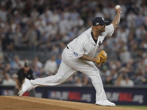 New York Yankees starting pitcher CC Sabathia (52) delivers against the Boston Red Sox during the first inning of Game 4 of baseball's American League Division Series, Tuesday, Oct. 9, 2018, in New York.