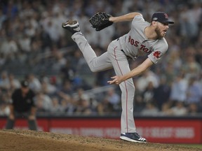 Boston Red Sox pitcher Chris Sale delivers against the New York Yankees during the eighth inning of Game 4 of baseball's American League Division Series, Tuesday, Oct. 9, 2018, in New York.