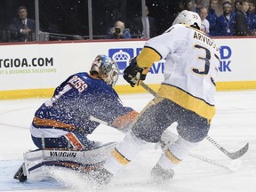 Nashville Predators left wing Viktor Arvidsson (33) scores a goal past New York Islanders goaltender Thomas Greiss (1) during the first period of an NHL hockey game, Saturday, Oct. 6, 2018, in New York.