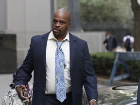 FILE - In this Oct. 4, 2018 file photo, Brian Bowen Sr. arrives at federal court in New York. Bowen, the father of a blue-chip college basketball recruit, has testified that an assistant coach at the University of Louisville gave him a secret cash payment of $1,300 as part of a deal to get the son to sign with the school.