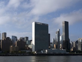 In this Oct. 10, 2018 photo, Trump World Tower, right, rises above the United Nations headquarters, center, in New York. Donald Trump's business ties to Saudi Arabia run long and deep, and he's often boasted about his business ties with the kingdom. Now those ties are under scrutiny as the president faces calls for a tougher response to the kingdom's government following the disappearance, and possible killing, of one of its biggest critics, journalist and activist Jamal Khashoggi. Trump said Friday that he will soon speak with Saudi Arabia's king about Khashoggi's disappearance.