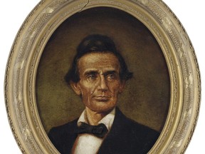 This undated photo provided by Swann Auction Galleries shows a circa 1860's oil painting of President Abraham Lincoln, entitled "Portrait of the beardless Lincoln as he appeared in June 1860," by John C. Wolfe. The item was among a collection of hundreds of Lincoln books, artwork and documents sold at auction by Swann Auction Galleries on Thursday, Sept. 28, 2018 in New York.