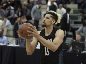FILE - In this May 17, 2018, file photo, standout college basketball recruit Brian Bowen participates in the NBA draft basketball combine in Chicago. A recruiter, a coach and a former Adidas executive are scheduled to go on trial in New York in a criminal case that exposed corruption in several top U.S. college basketball programs. It also led to the firing of Hall of Fame coach Rick Pitino of Lousiville and sidelined the playing career of Bowen.