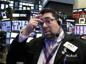 Trader Michael Capolino works on the floor of the New York Stock Exchange, Thursday, Oct. 11, 2018. The market's recent decline was set off by a sharp drop in bond prices and a corresponding increase in yields last week and early this week.