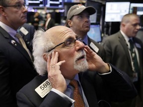 Trader Peter Tuchman works on the floor of the New York Stock Exchange, Thursday, Oct. 11, 2018. The market's recent decline was set off by a sharp drop in bond prices and a corresponding increase in yields last week and early this week.