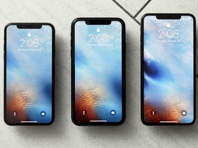 This Monday, Oct. 22, 2018, photo shows from left, the iPhone XS, iPhone XR, and the iPhone XS Max in New York. The XR falls between the top-of-the-line XS models in size, but is lower in price.