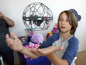 In this Aug. 30, 2018, photo Gabriel, 12, plays with an Air Hogs Supernova quadcopter at the Walmart Toy Shop event in New York. Walmart says 30 percent of its holiday toy assortment will be new. It will also offer 40 percent more toys on Walmart.com from a year ago. In November and December, the company's toy area will be rebranded as "America's Best Toy Shop."